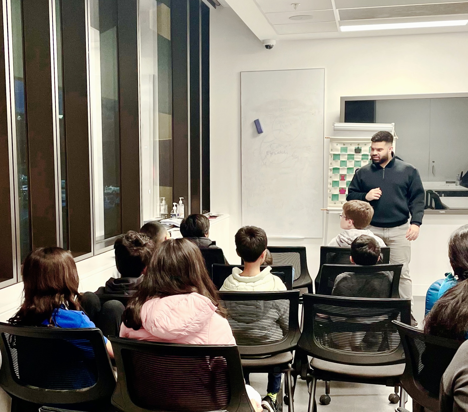 Coach Kheminda teaching a chess class at Bunjil Place