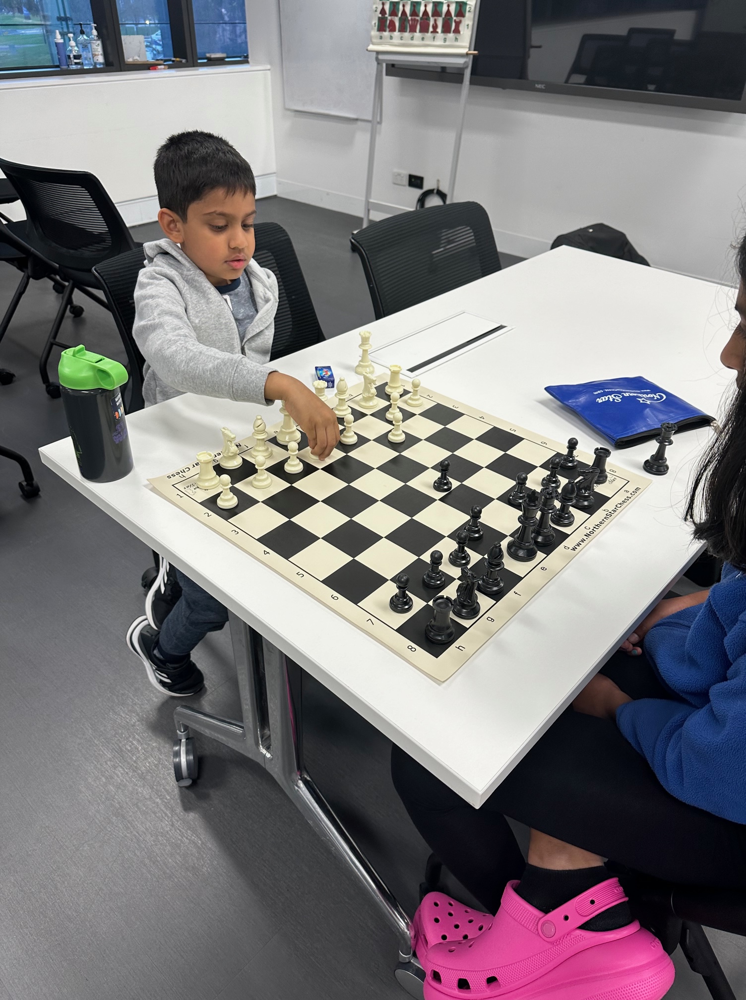 Two Oz Chess Kids students playing a game